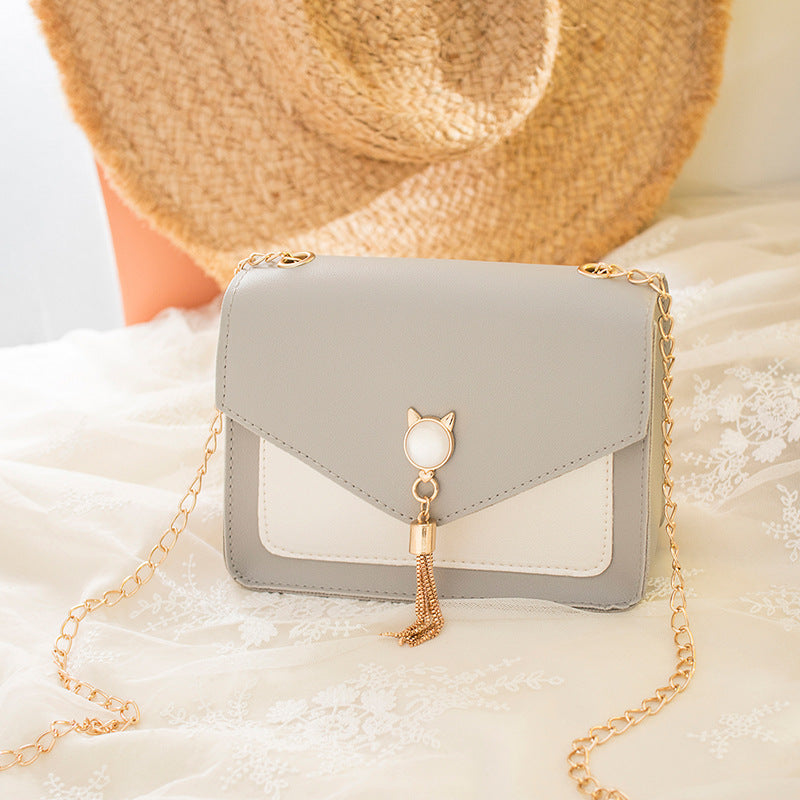 Petit sac bandoulière avec pompon chat