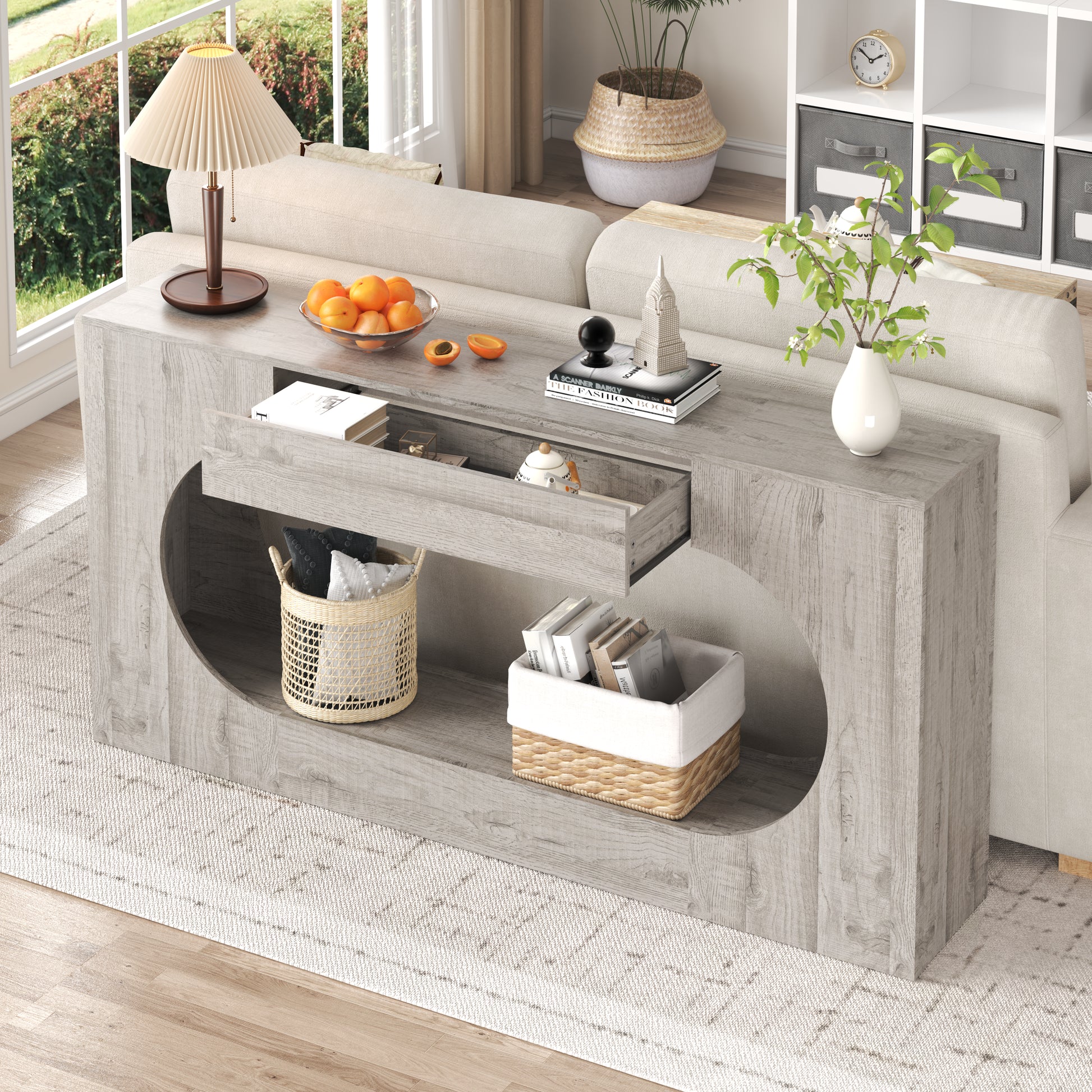 Console d'entrée grise avec tiroir et découpe ovale ajourée