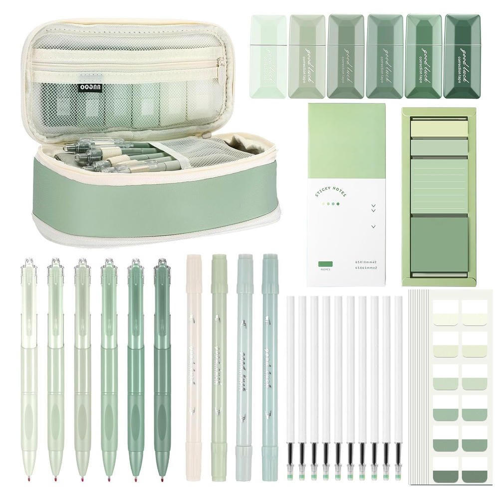 Set de bureau vert avec bloc-notes, stylos et surligneurs