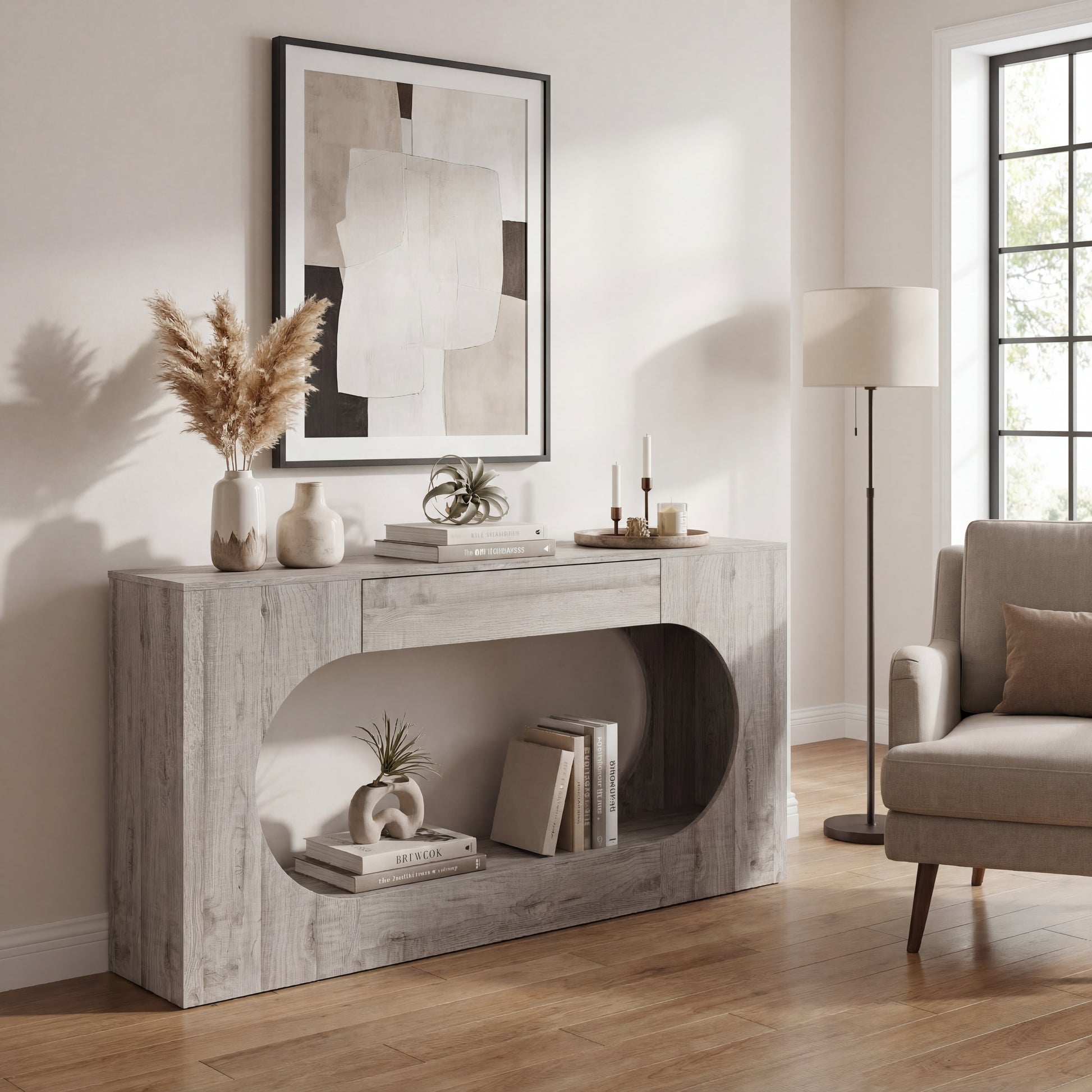 Console d'entrée grise avec tiroir et découpe ovale ajourée